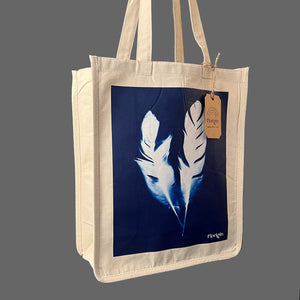 Canvas Tote Shopper with blue image of two feathers sold in the florig.in store